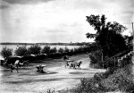 In this photo of East Calhoun Parkway in about 189, you can see the bridge foundation at the extremeright, where one carriage is turning onto 36th Street. The fountain in the boulevard for watering horses was an interesting touch.(Minnesota Historical Society)