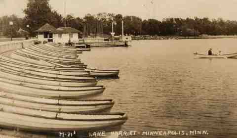This photo was taken very shortly after the Lake Harriet pavilion was destroyed by a tornado in 1925. It's the only photo I've seen of Lake Harriet without a pavilion. A pile of rubble marks the spot where the pavilion once stood. It's unlikely that a man as insistent upon beauty and efficiency as park superintendent Theodore Wirth would have allowed the rubble to remain for long, so this photo must have been taken in the few days after the storm in mid-July. (From the author's personal collection.)